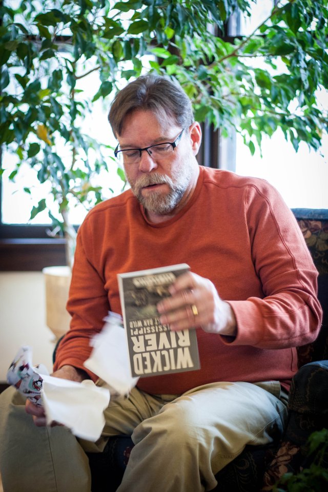 John Miller receiving a book